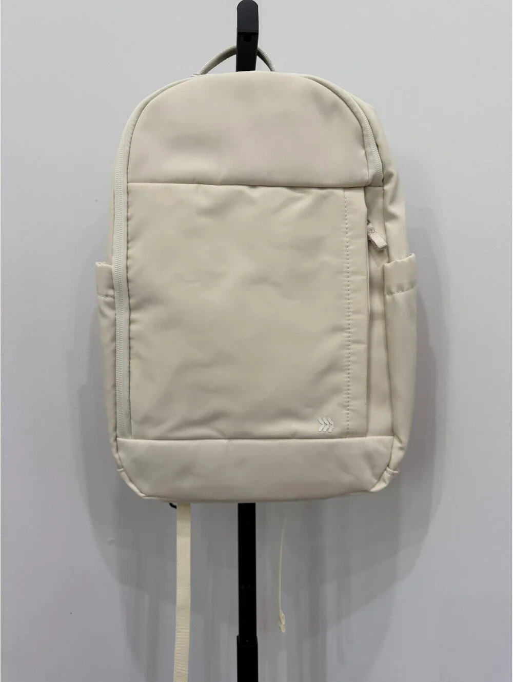 All in Motion Minimalist Cream Backpack with Side Pockets and Padded Straps